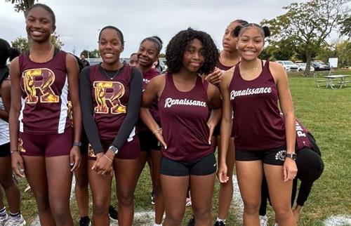 Girls cross country team posing before meet